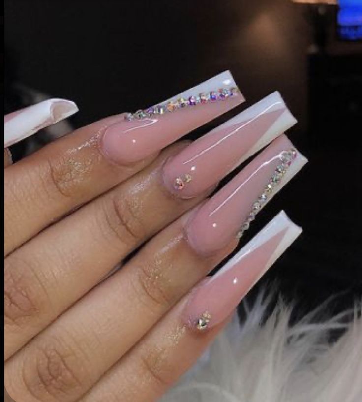 Chic Long Pink Nails with White Tips and Sparkling Rhinestones: A Perfect Blend of Classic Elegance and Modern Flair.