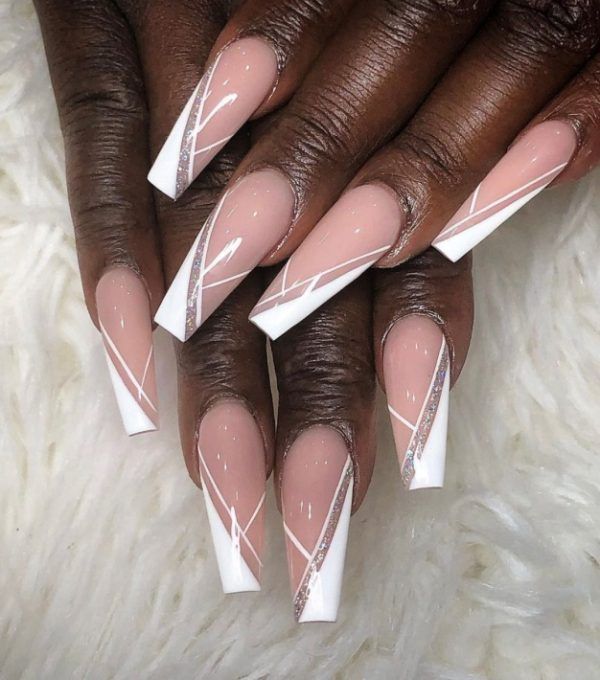 Chic Nail Design: Soft Nude Base with White French Tips and Sparkling Accents