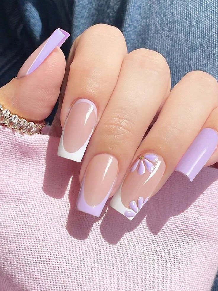 Elegant Lavender and Nude Nail Design with Floral Accents for a Playful Spring/Summer Look.