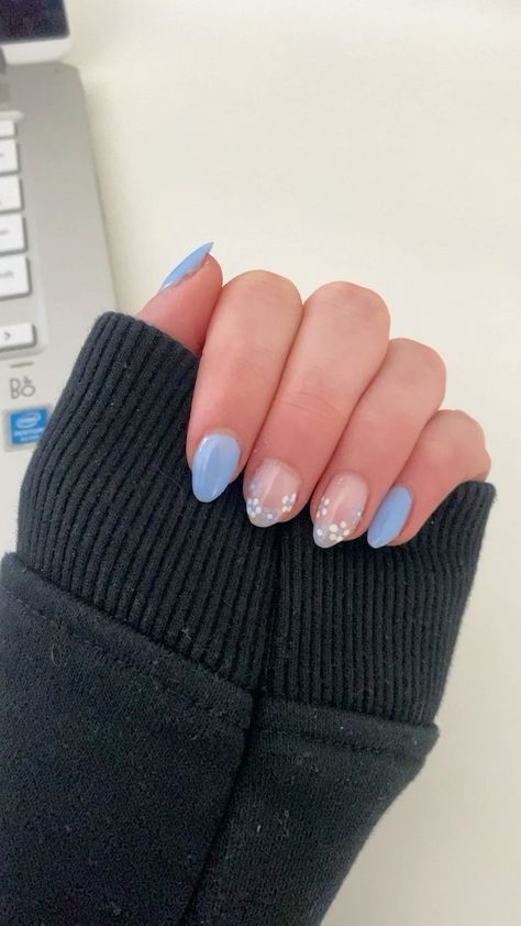 Charming Soft Blue Manicure with Elegant French Tips and Playful Dots.