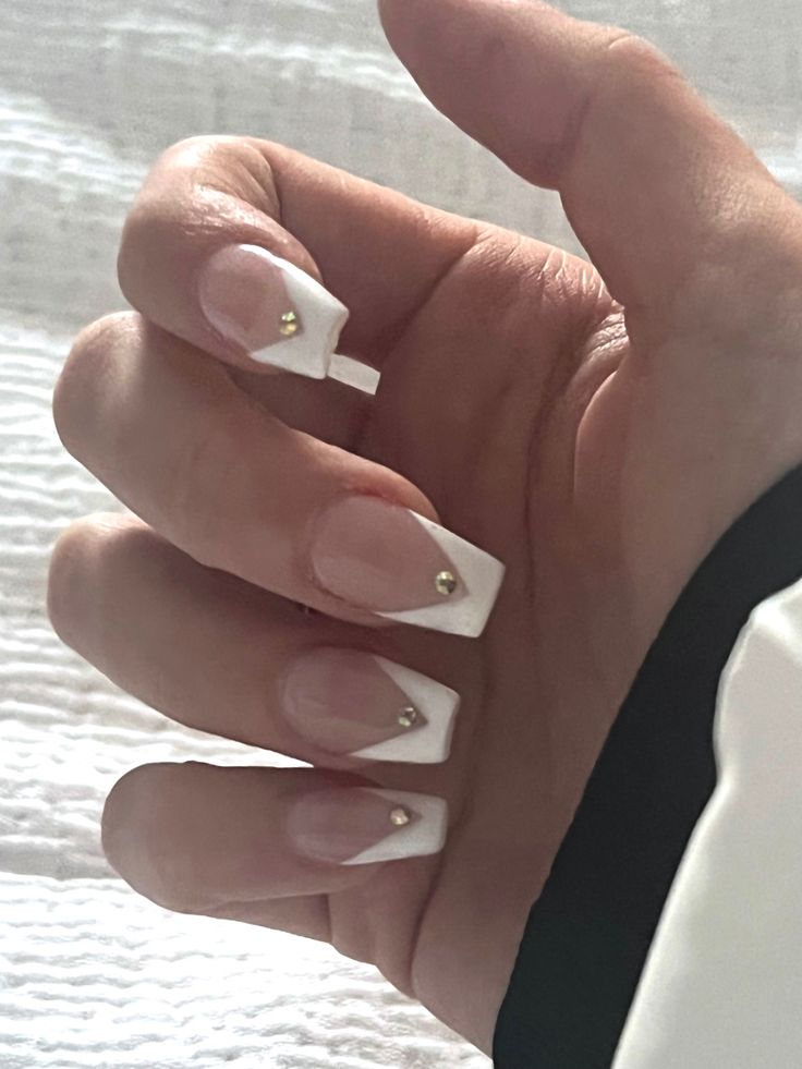 Chic French Tip Nail Design with Soft Pink, Crisp White, and Gold Accents.