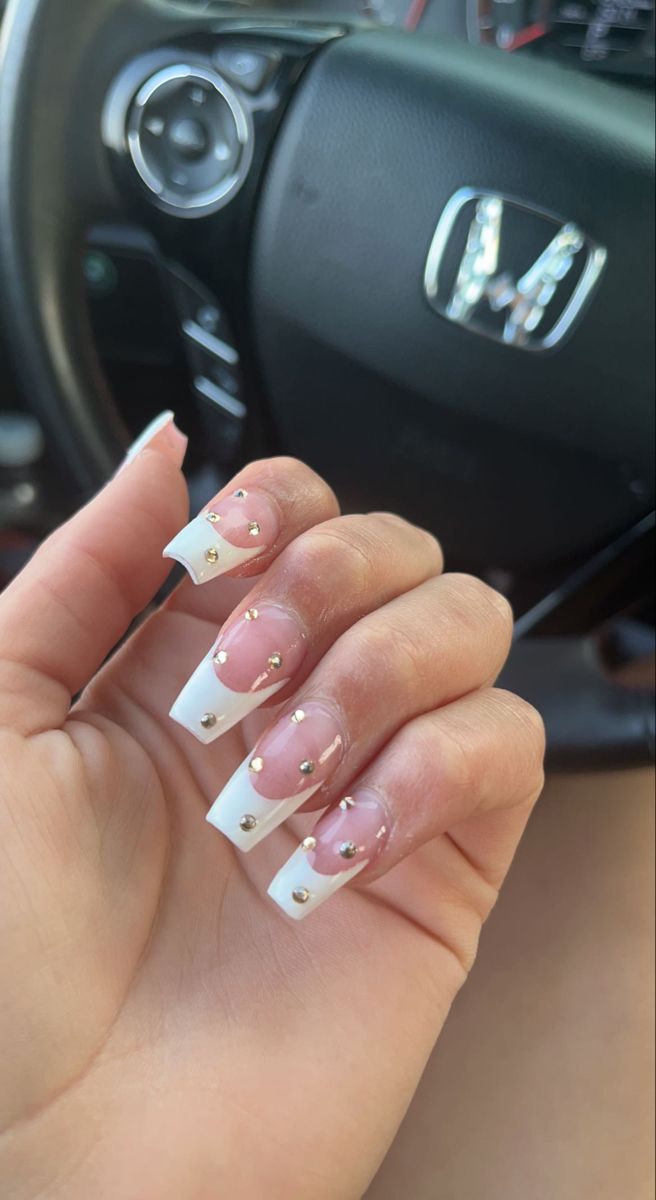 Chic French Tip Nail Design with Transparent Elements and Gold Studs for Any Occasion