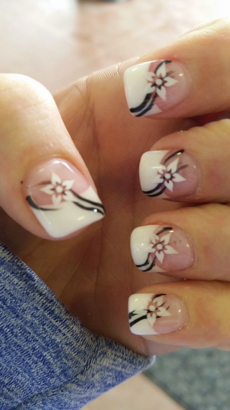 Elegantly Playful Floral Nail Design in Soft Pink and White with Black Accents.