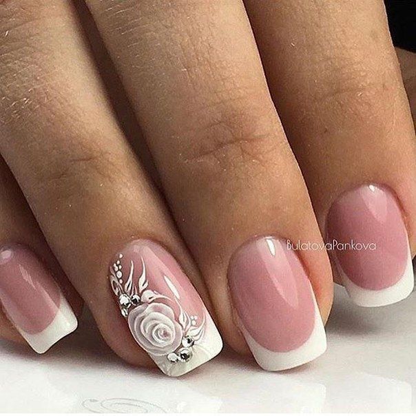 Chic Romantic Nail Design: Soft Pink Base with Classic French Tips and Intricate Floral Accent