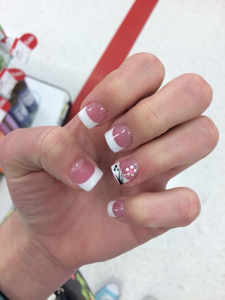 Sophisticated French Tip Nail Design with Floral Accents in Soft Pink.