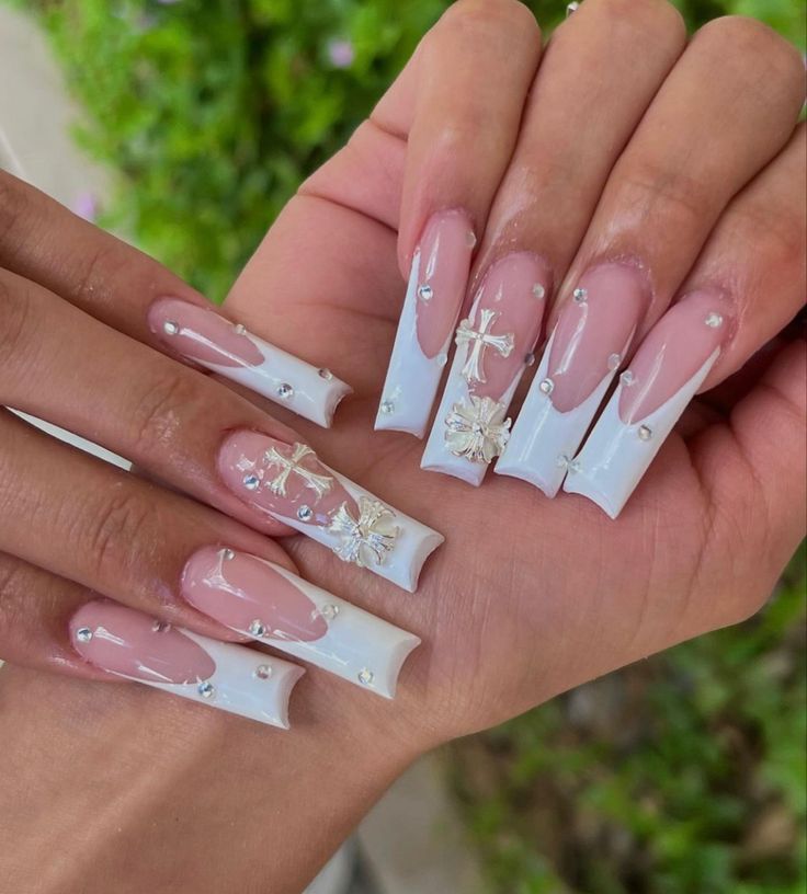 Sophisticated Elegant Nail Design with Pink and White Tips, Floral Patterns, and Gemstones.