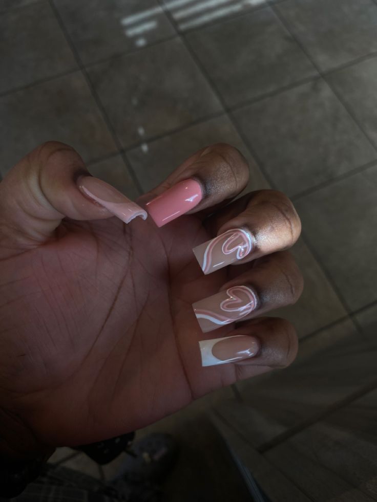 Chic Soft Pink and White Swirl French Manicure Design.