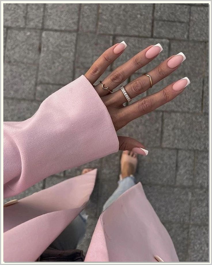 Sophisticated Chic: Soft Pink Nails with French Tips and Elegant Accessories.