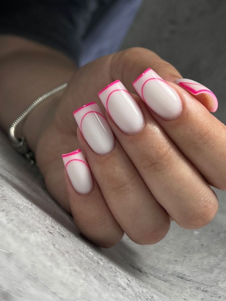 Chic Contemporary Nail Design: Nude Base with Playful Bright Pink Tips