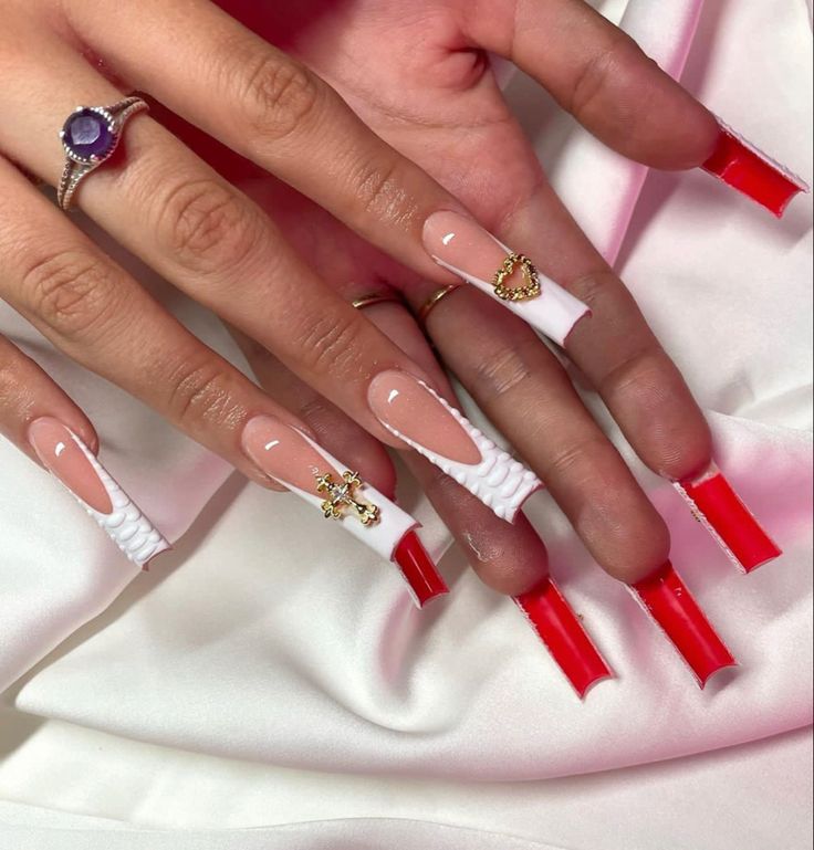 Chic Nail Design: Elongated Rectangular Tips in Glossy White and Bold Red with Textured Accents and Metallic Embellishments.