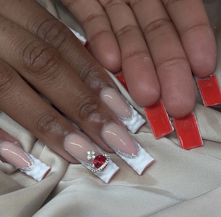 Chic Almond-Shaped Nail Design with Elegant White Tips and Red Gemstone Accent