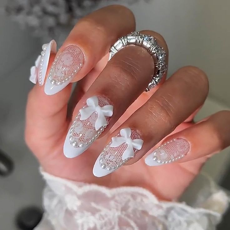 Sophisticated White Lace Nail Design with Bows and Pearls for Special Occasions