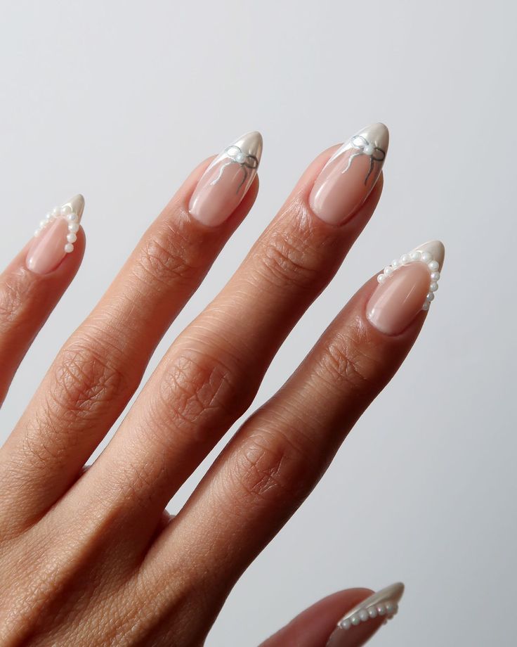 Elegant Chic Nail Design: Soft Nude Base with French Tips and Pearl Accents