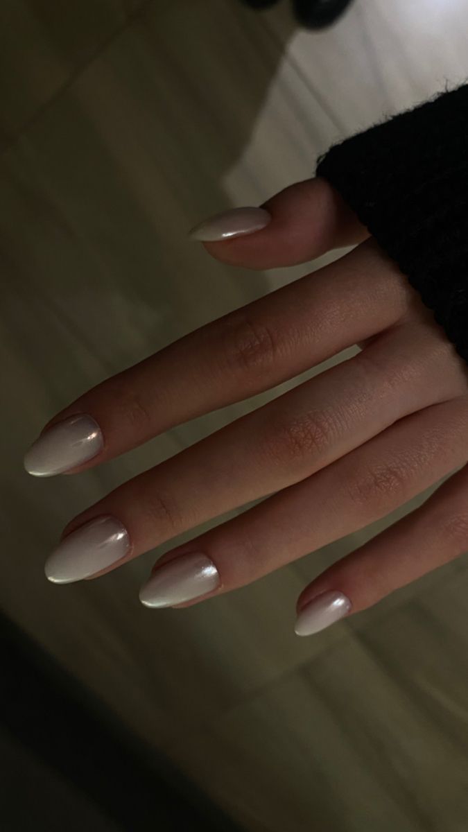 Elegant Almond-Shaped Nails with Glossy Nude Polish: A Minimalist Enhancement of Natural Beauty.