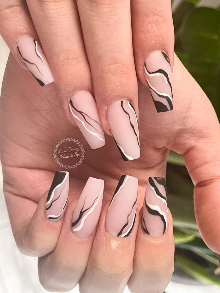 Chic Pink Base with Striking Black and White Marble Nail Design