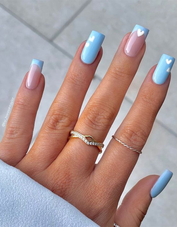 Whimsical Blue and Nude Nail Design with Heart Accents