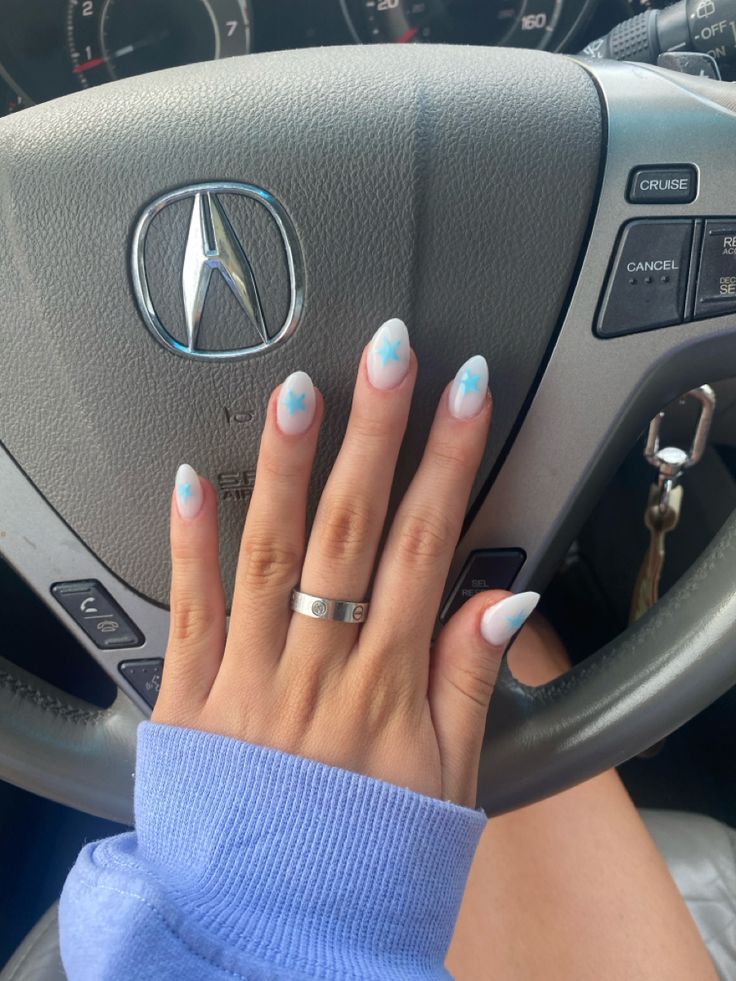 Whimsical Gradient Nail Design: Light Blue to Crisp White with Cloud Accents for a Trendy Summer Look.