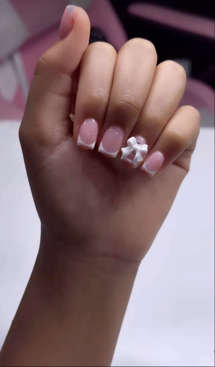 Chic Soft Pink and White Manicure with Embellished Accent Nail.