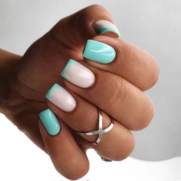 Elegant Pastel Nail Design with Mint Green and Soft White Curved Tips.