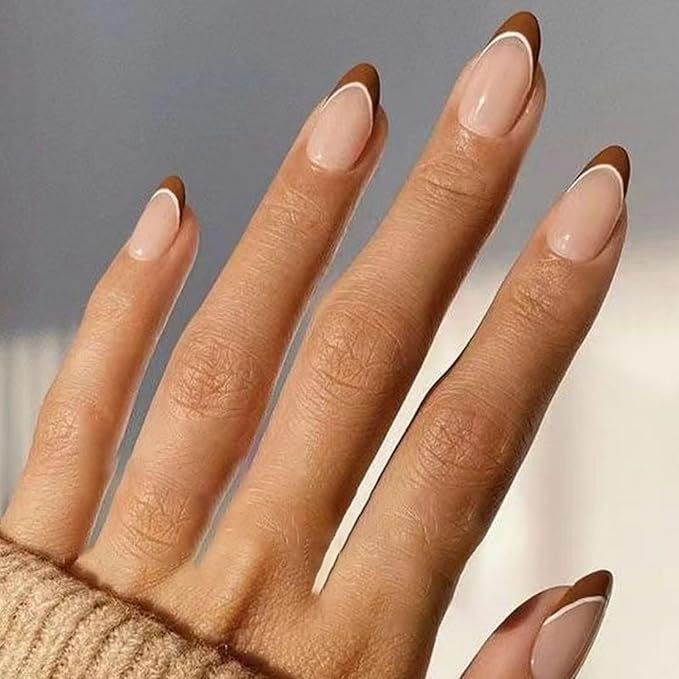 Elegant Almond-Shaped Nails: Earthy Brown Tips with White Outline on Nude Base.