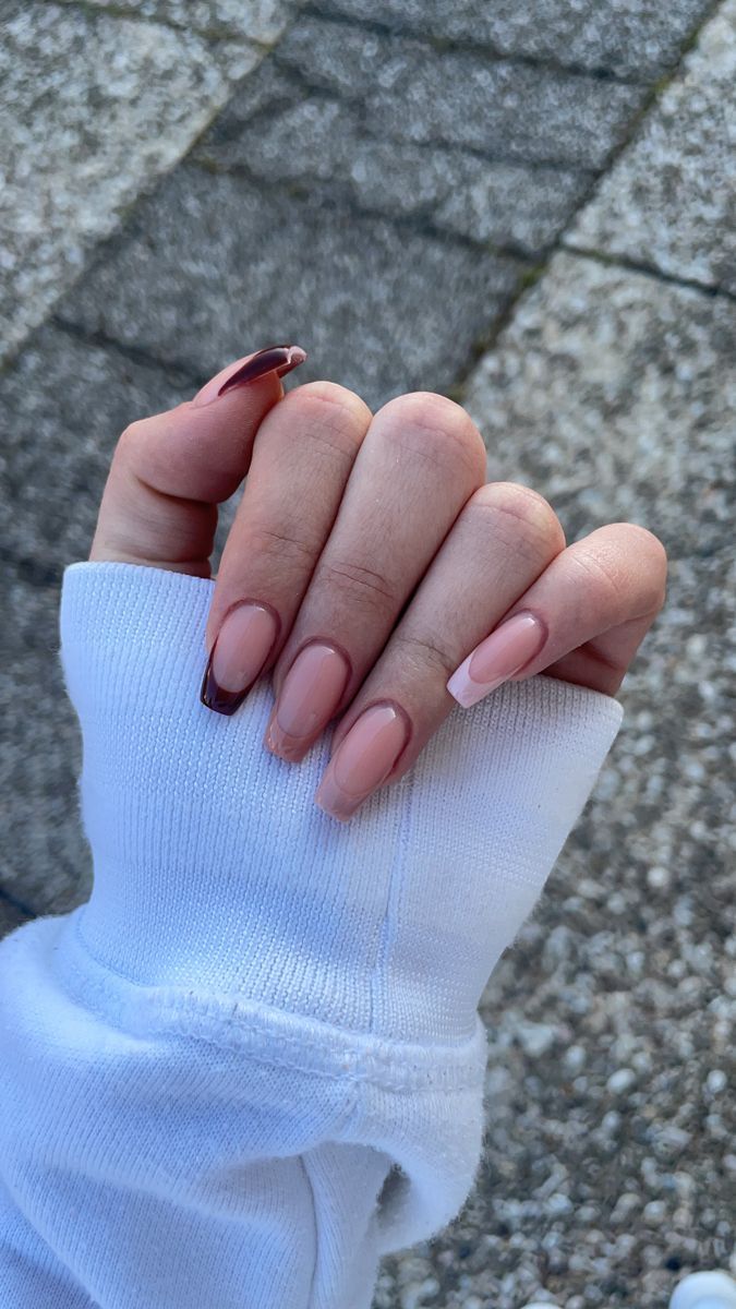 Sophisticated Nail Design: Soft Nude with Contrasting Ombre Tips