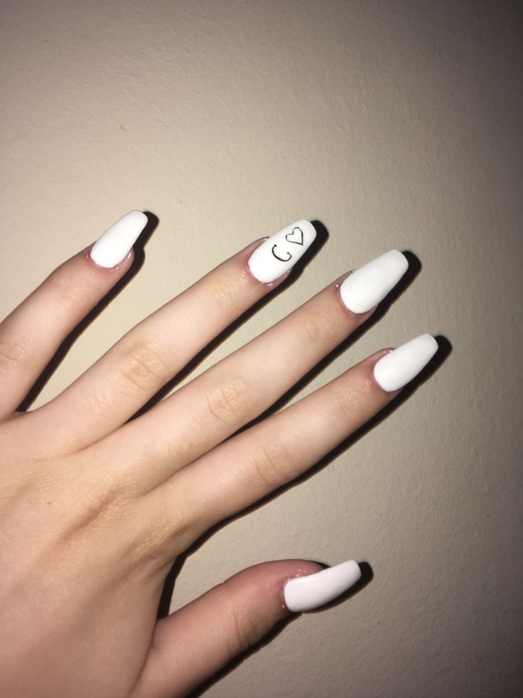 Chic Elegant White Nail Design with Minimalist Heart and Playful Accent Tips.