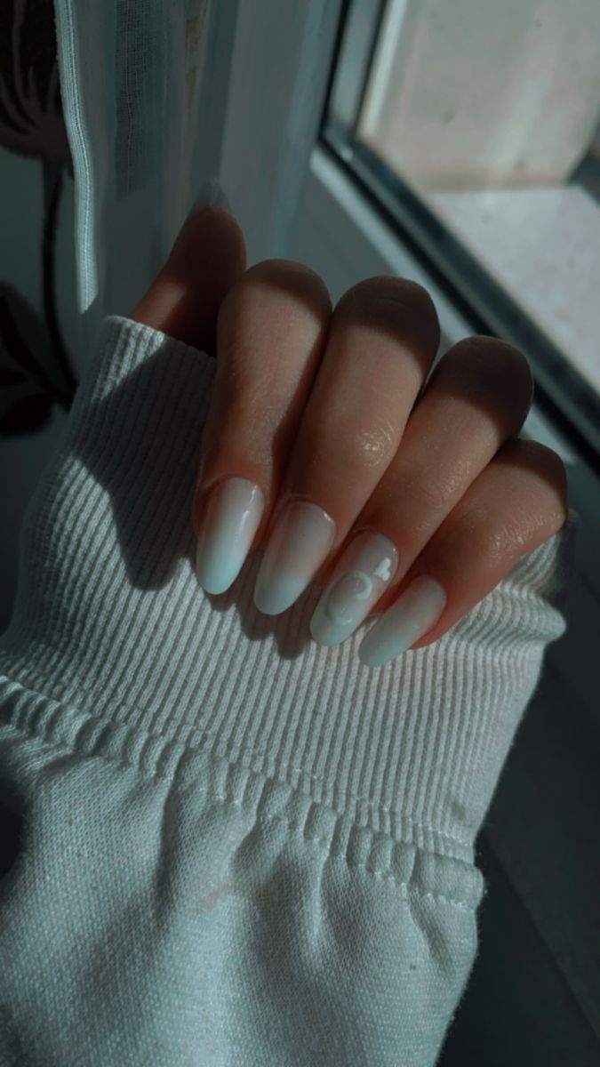 Refined Elegant White Ombre Nails with Artful Swirls