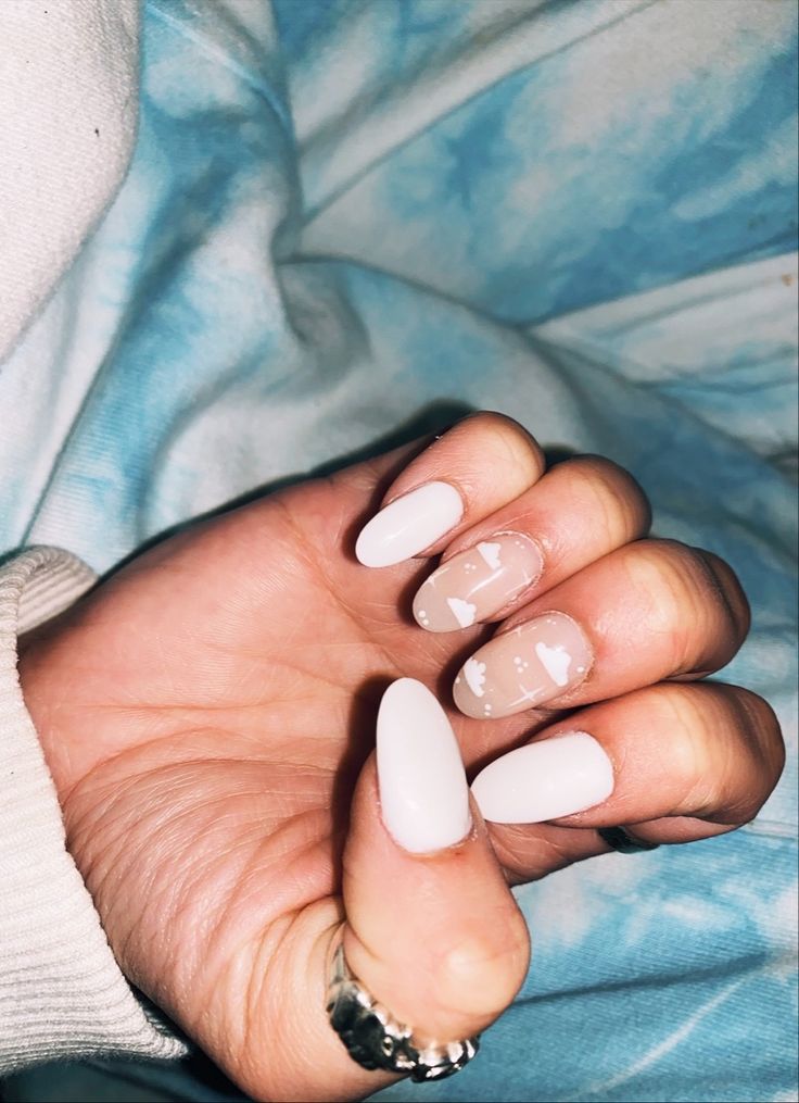 Chic Glossy White Nail Design with Pastel Accents and Abstract Art.