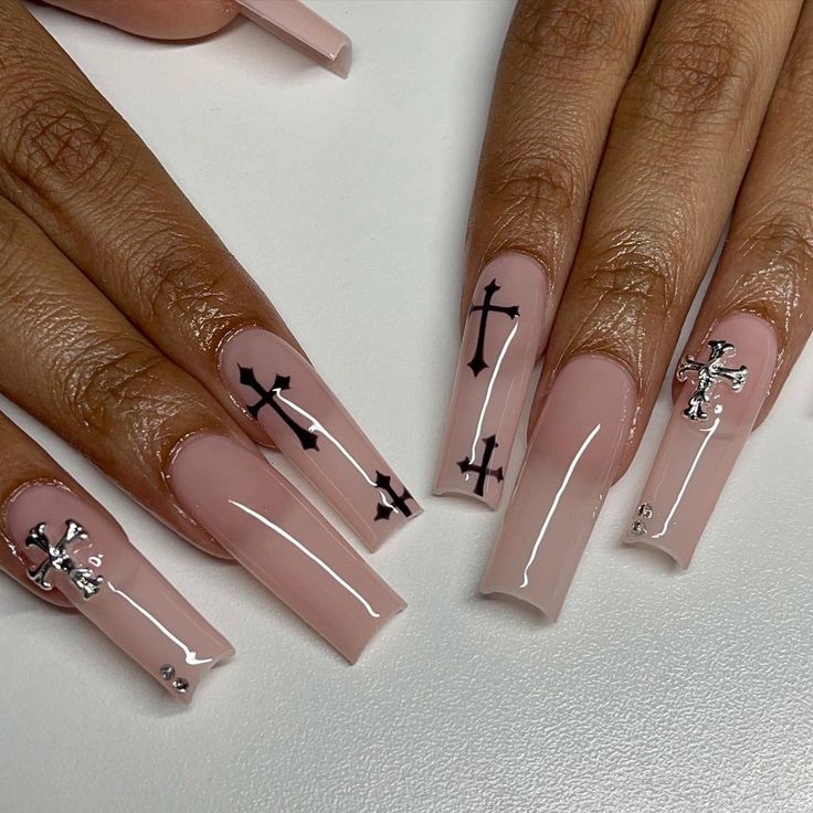 Chic Elegant Nail Design: Soft Nude Base with Bold Black Cross Patterns and Silver Accents