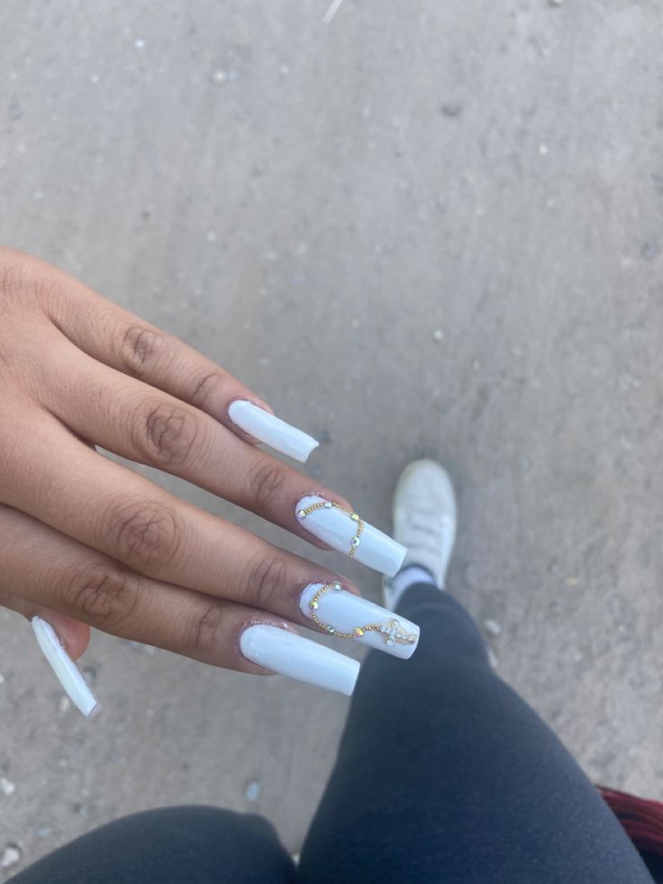 Elegant White Nail Design with Embellished Rectangular Tips and Gold Accents