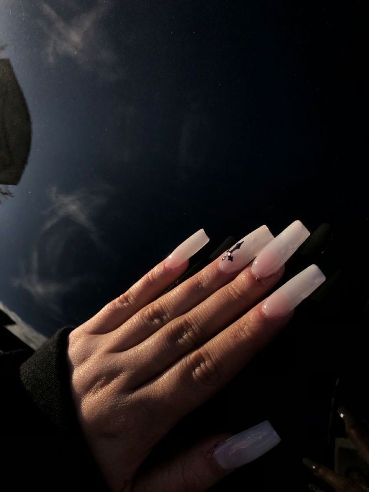 Chic Gradient Long Nails with Subtle Black Accents and Shiny Finish.