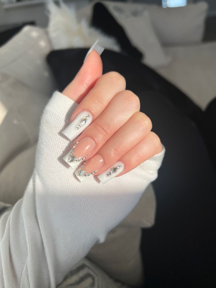 Sophisticated Chic: Elegant Nude Nail Design with Striking Silver Accents