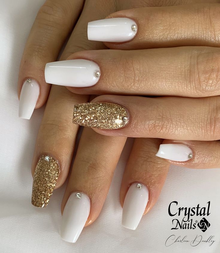 Elegant Square Nail Design with White Polish, Gold Accents, and Rhinestone Embellishments.