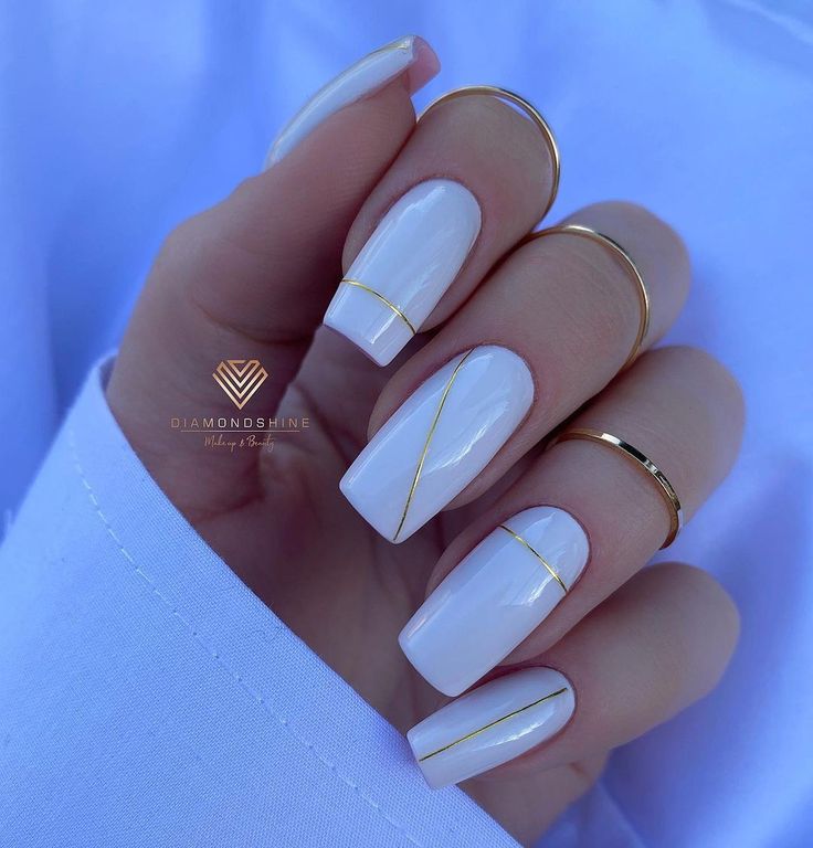 Chic White and Gold Geometric Nail Design: A Modern Touch of Sophistication.