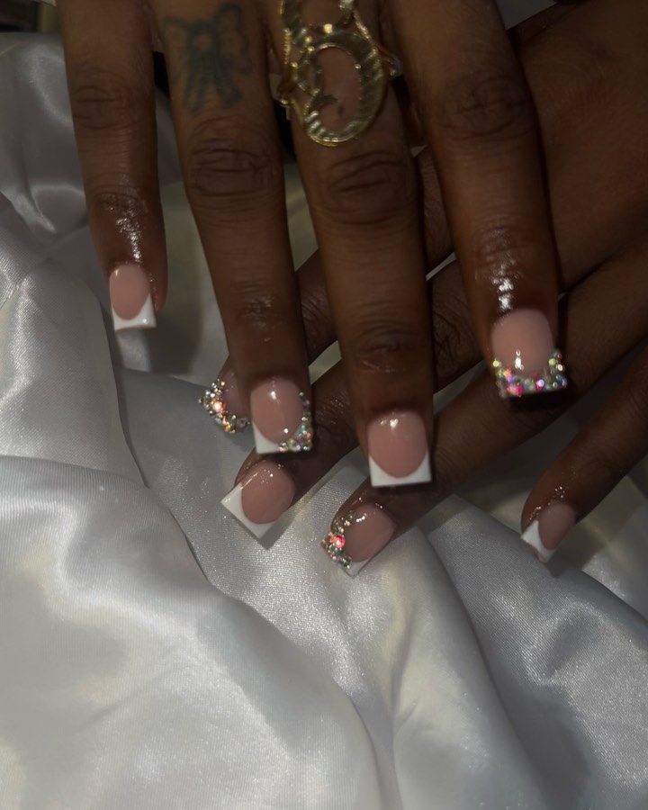 Sophisticated Nude and French Tip Manicure with Sparkly Rhinestone Accents