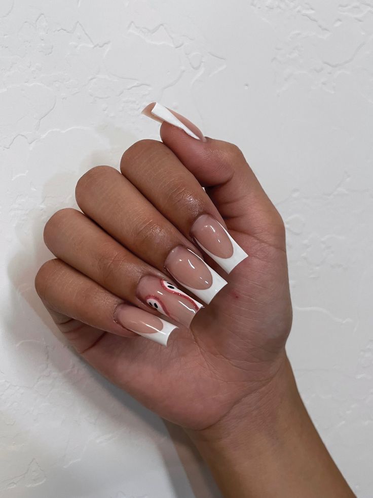 Chic Almond-Shaped Nails with Nude and White Glossy Design