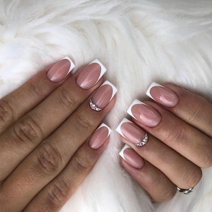 Sophisticated Nude and White Nail Design with Glamorous Rhinestones