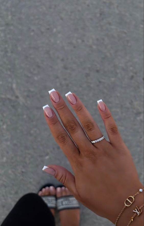 Sophisticated Classic French Tip Nail Design with Chic Accessories.