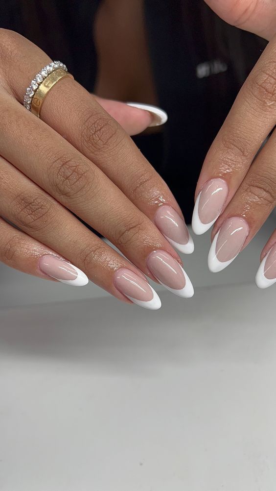 Sophisticated Almond-Shaped French Manicure with Glossy Nude Base and White Tips.