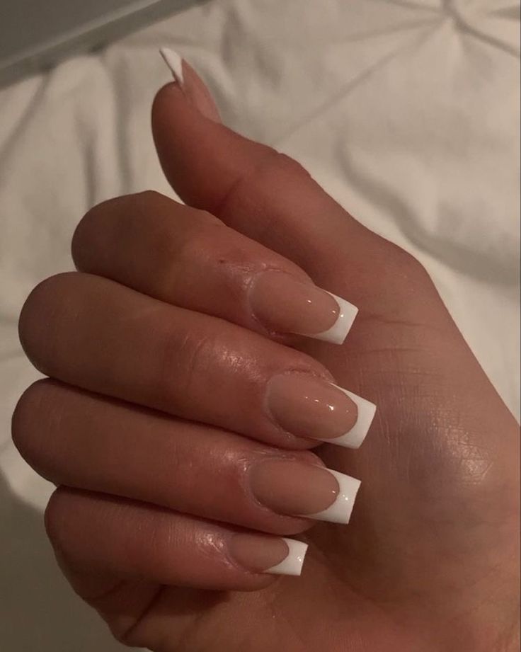 Timeless Elegant French Tip Nails with Nude Base and Sophisticated White Tips.