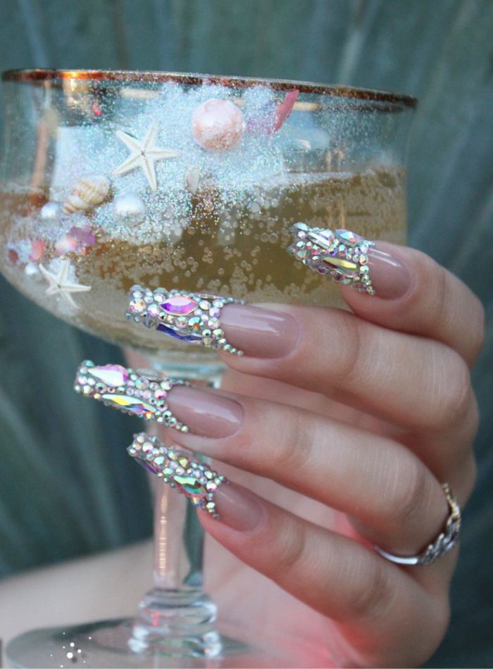 Elegant Almond-Shaped Nail Design with Iridescent Rhinestones for Special Occasions