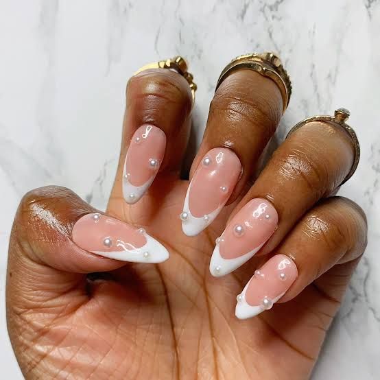 Chic Almond-Shaped Nails: Soft Pink Base with White Tips and Pearl Accents