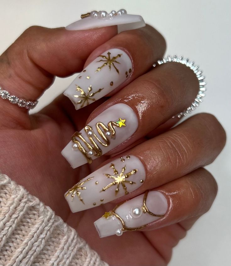 Elegant Matte Nail Design with Gold Accents and Pearl Embellishments