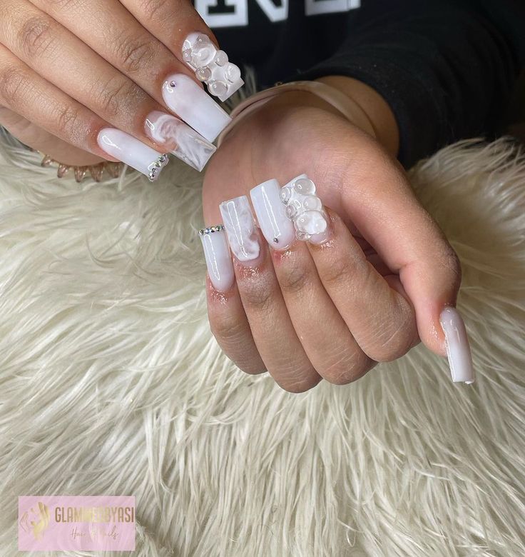 Sophisticated Elegant Long Nails Featuring Glossy and Matte Finishes with Unique 3D Embellishments and Sparkling Accents.