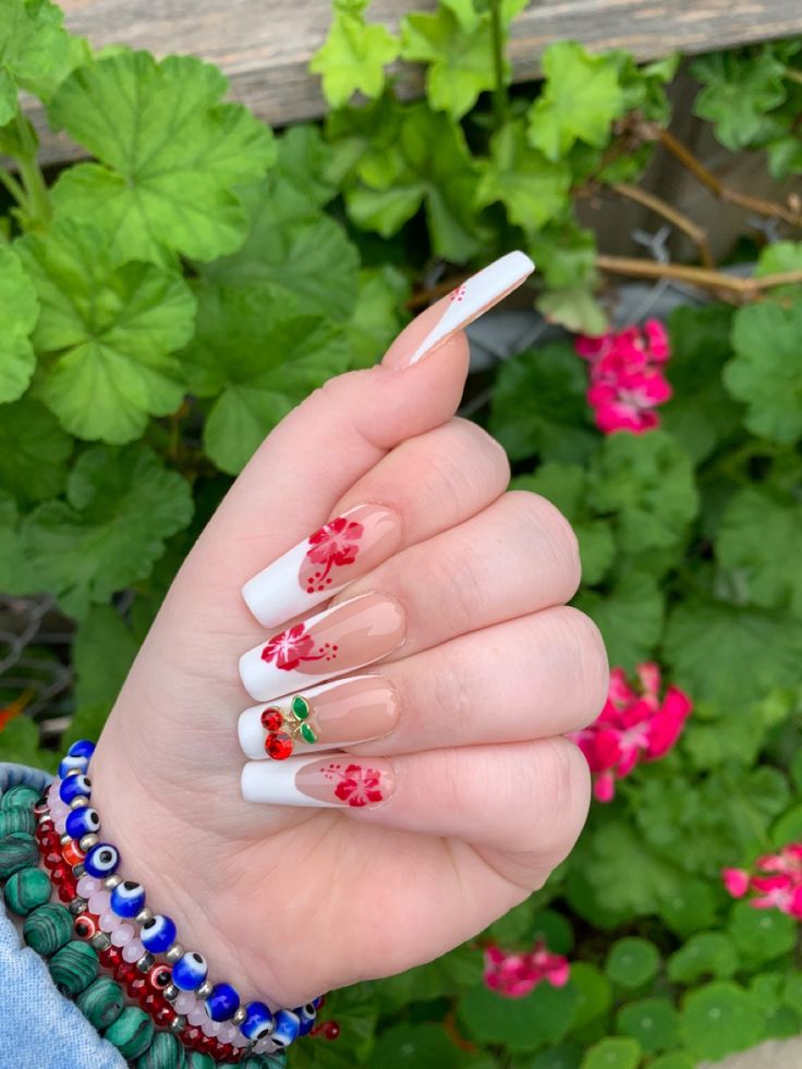 Chic Floral Nail Design: Elegant White Tips with Vibrant Red Flowers and Green Leaves for a Fresh Summer Aesthetic.