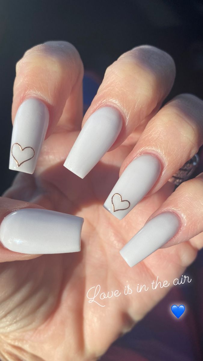 Elegant Pastel Nail Design: Charming Heart Outlines on a Soft Gray Base.