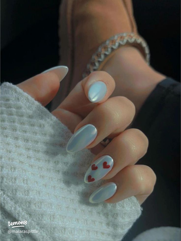 Chic Iridescent Nail Design with Glossy Finish and Playful Heart Accents.