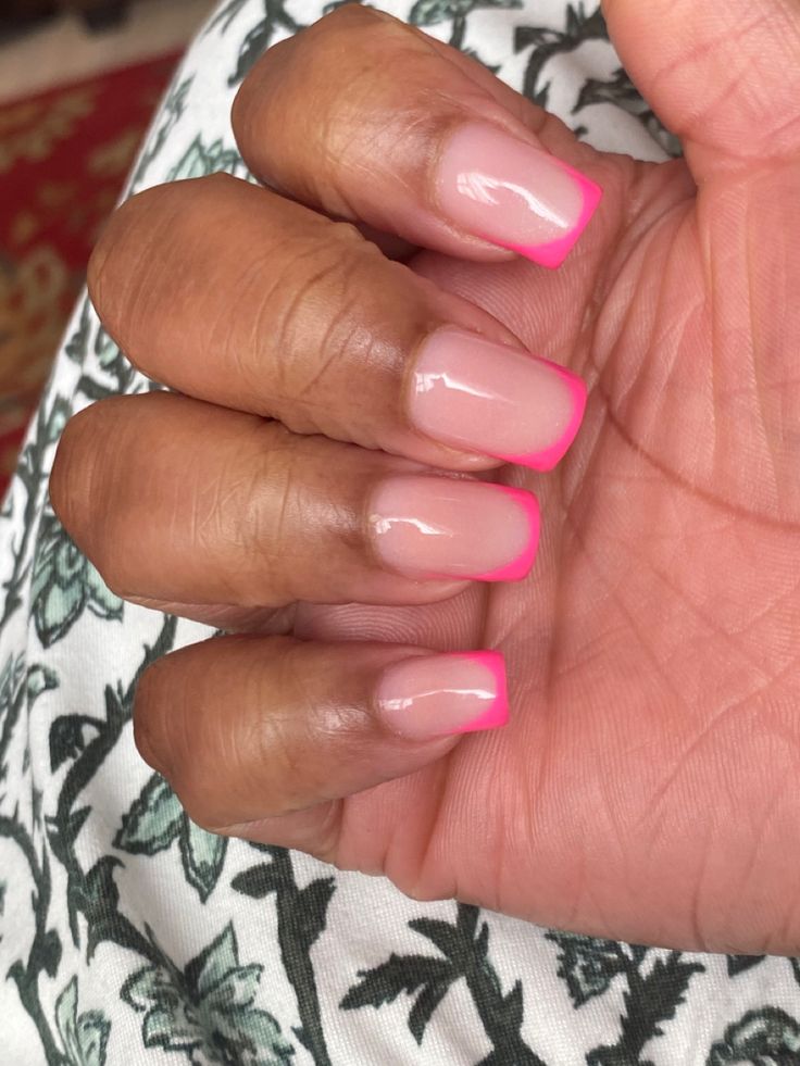 Sophisticated Glossy Square Nail Design: Soft Nude Base with Vibrant Pink Tips.