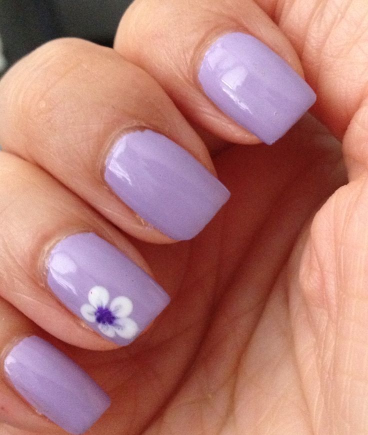 Charming Lavender Nail Design with Glossy Finish and Floral Accent for Spring/Summer.