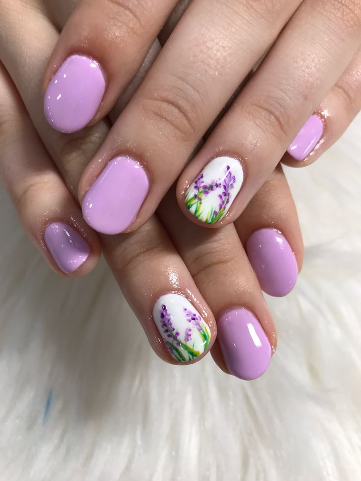 Soft Lavender Nail Design with Floral Accents: A Charming Spring Inspiration.